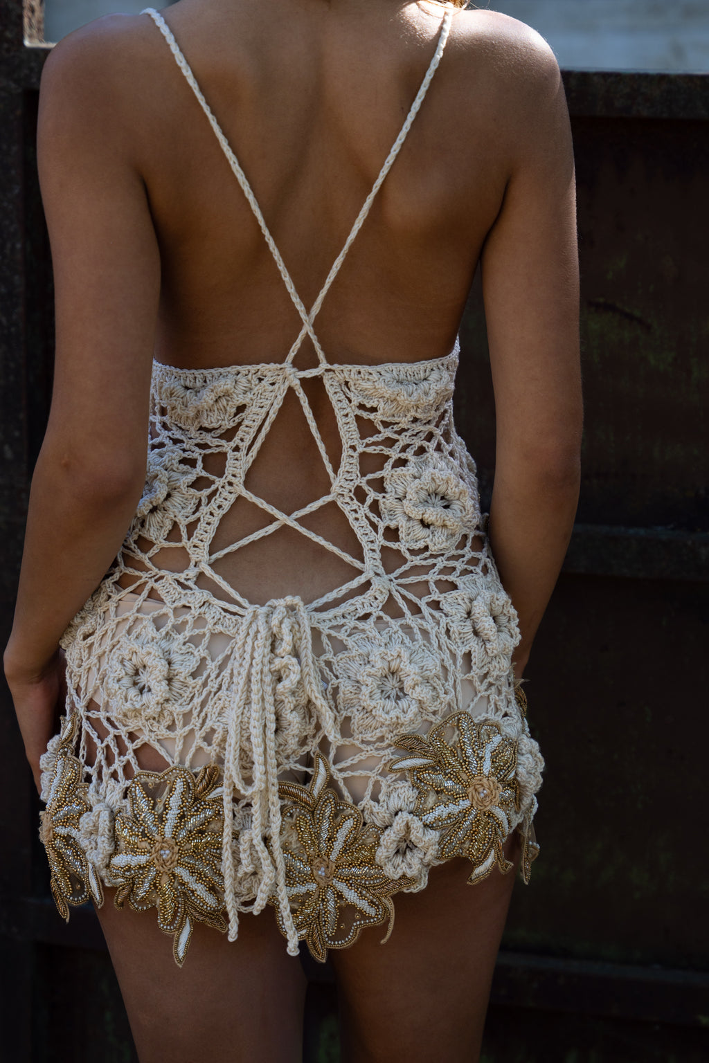 La Sirenita hand-crocheted cream mini dress with hand-embroidered patches and adjustable straps

